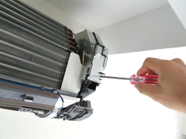 Aircon Repair Specialist remove the air conditioner control board from the aircon unit